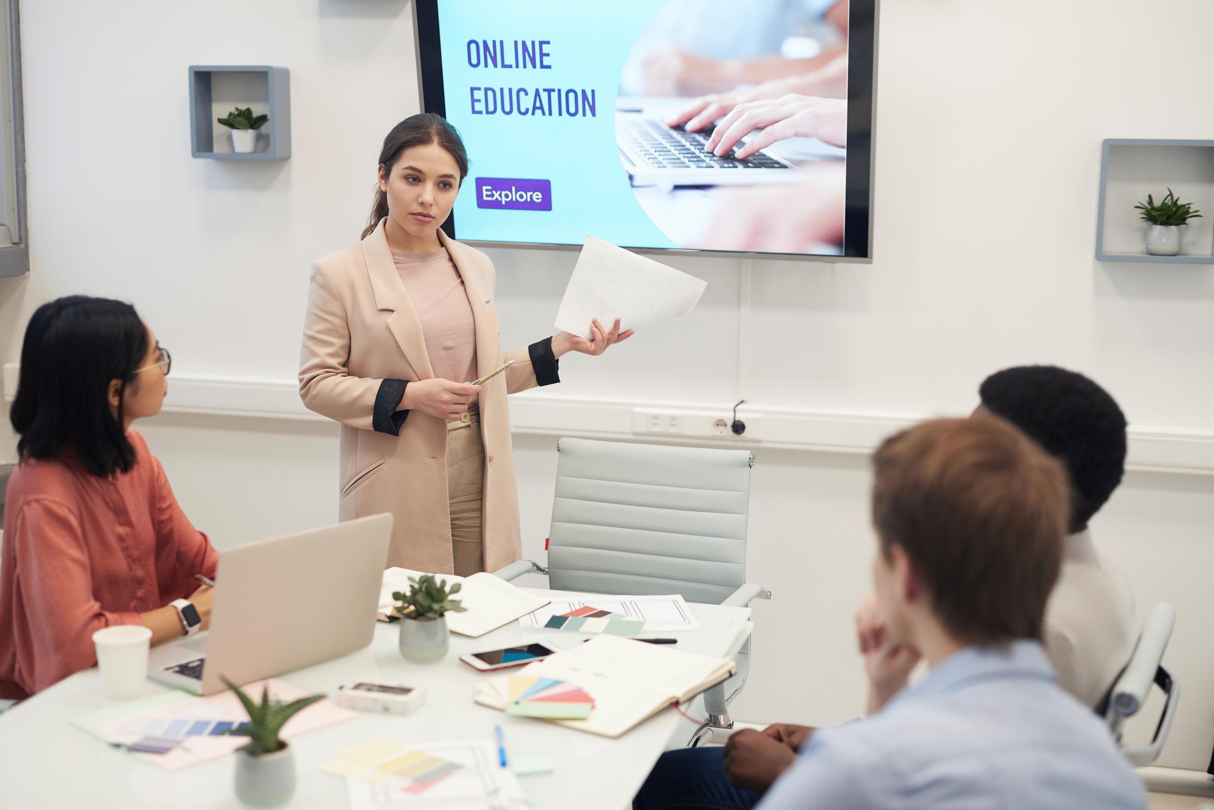 portrait-young-businesswoman-giving-presentation-online-education.jpg